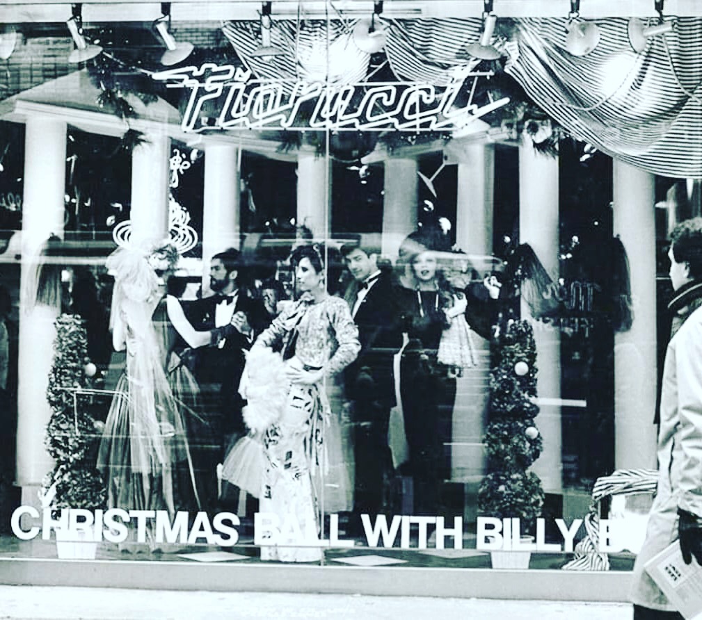 The windows of Fiorucci in New York, 1980: "A Christmas Ball With Billy Boy". Various mannequins are dressed in Surreal Couture evening wear, notably a newspaper print gown with Billy Boy press articles on it.